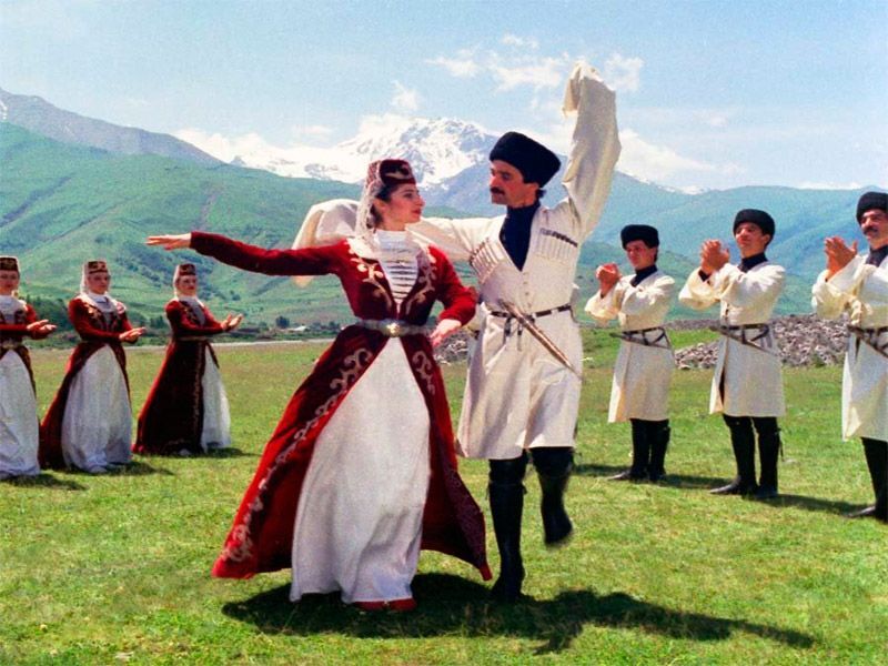Traditional Georgian dancers performing in traditional costumes