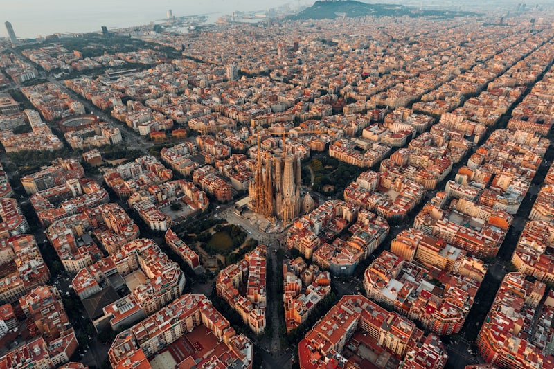 Barcelona skyline featuring Gaudi's Sagrada Familia basilica with its distinctive spires rising above the city