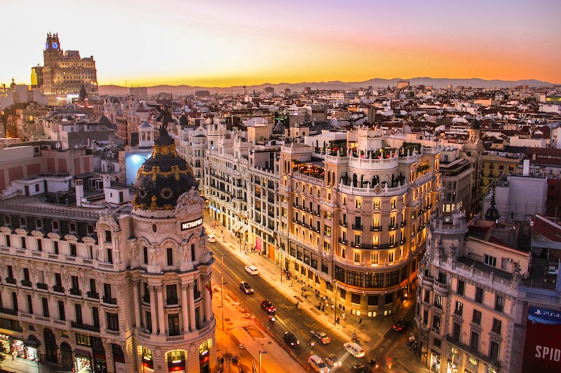 Madrid cityscape showing the iconic Gran Via boulevard with historic architecture and busy streets